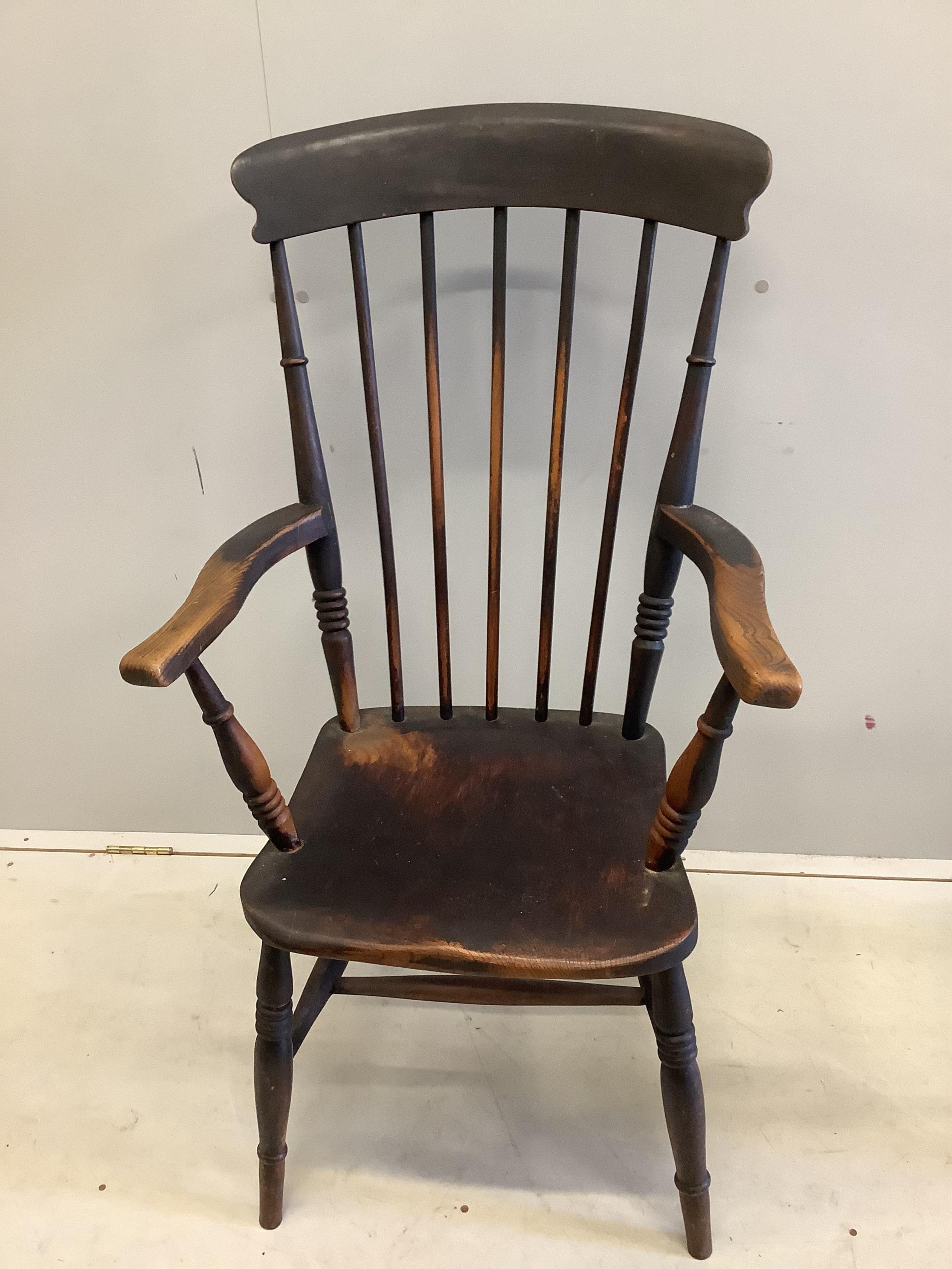 Two Victorian elm and beech Windsor comb back armchairs, larger width 58cm, depth 43cm, height 111cm